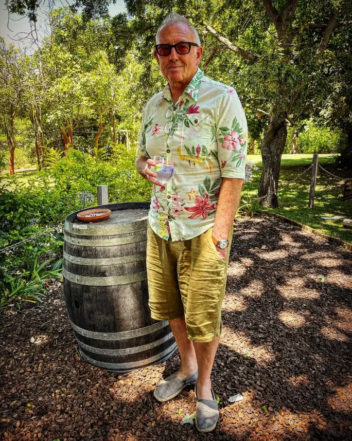 Telford Vice at a winery, next to a barrel